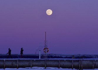 A shining and golden full moon over the pastel colour sky, Espoo, Finland