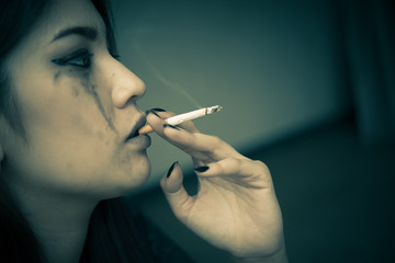 Obraz premium Asian woman sad from love,She smoking because stress from boyfriend,Heartbreak woman concept