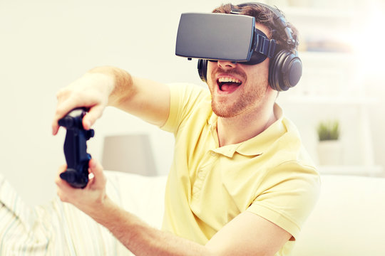 man in virtual reality headset with controller