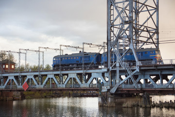 Train on the steel double-deck drawbridge over the Pregolya River in Kaliningrad (Konigsberg), Russia. The bridge was built in the 1913-1926 and was reconstructed in 1959-1965.