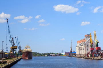 Fototapeta premium Heavy harbour jib cranes in the Kaliningrad Sea Fishing Port.