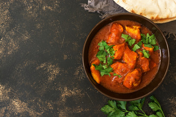 Chicken Tikka masala in the bowl. Asian food. Top view, copy space.