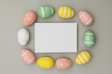 Easter holiday background. Pastel coloured decorated easter eggs with a blank white label.