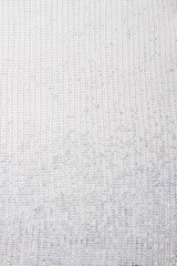 Fototapeta na wymiar White wool vertical texture. Close up textile material.