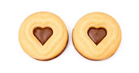 Chocolate heart in round biscuit isolated on white background