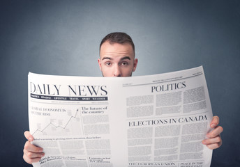 Businessman reading newspaper