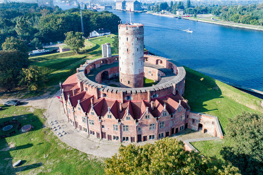 Medieval Wisloujscie Fortress with old lighthouse tower in port of Gdansk, Poland
A unique monument of the fortification works. Aerial view