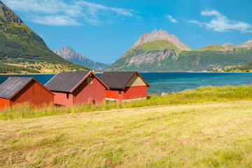Barns in Norway, Europe. Mountains, river, sky