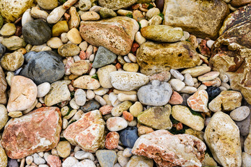 Many colorful stones on the beach. Texture background.