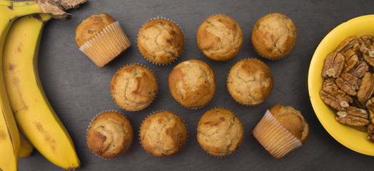 Classic Banana Nut Muffins on a Slate Cutting Board