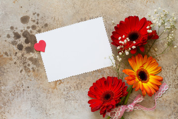 A bouquet of gerbera flower on a stone background or slate with copy space