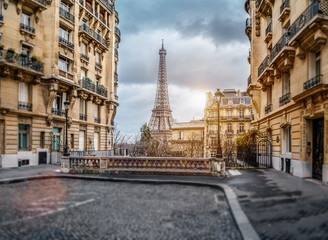 The eifel tower in Paris from a tiny street
