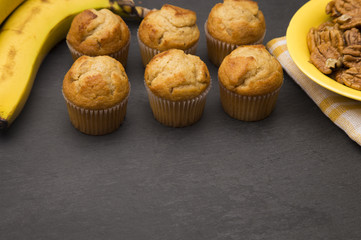 Classic Banana Nut Muffins on a Slate Cutting Board