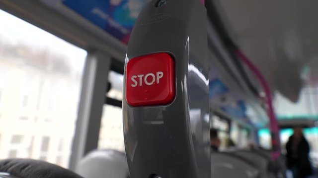 Close up of the stop button in a bus in the United Kingdom