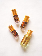 Arabian oud attar perfume or agarwood oil fragrances in mini bottles.

