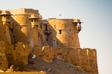 Curved sandstone walls of the famed golden fort in Jaisalmer rajasthan india. This famous tourist destination is india's only living fort