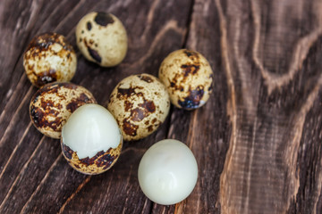 Quail eggs on a wooden table, a symbol of the Easter season. Healthy eating.