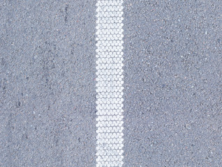 Texture of dry asphalt with white road markings, vertical tile