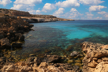 Fototapeta na wymiar Seascape with rocks on the shore of the Mediterranean Sea.