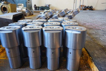 Naklejka premium white metal cylindrical parts after machining on the milling and lathe