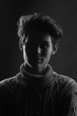 Fototapeta premium portrait of a beautiful teenager in a gray sweater