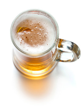 single mug of fresh beer isolated on white background