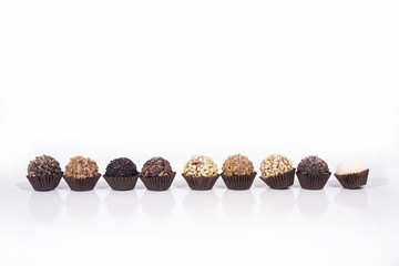 Sweet chocolate candies balls with nuts.