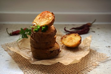 baked potatoes as a tower. put together on the baking paper. With parsley and chilli