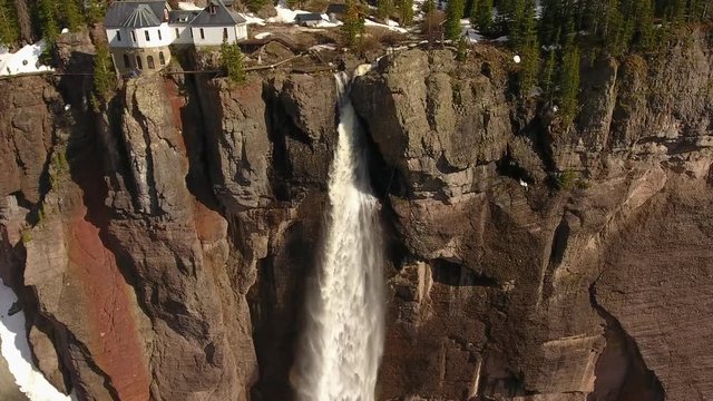 Astonishing House Perched on Gigantic Cliff Revealing Huge Waterfall