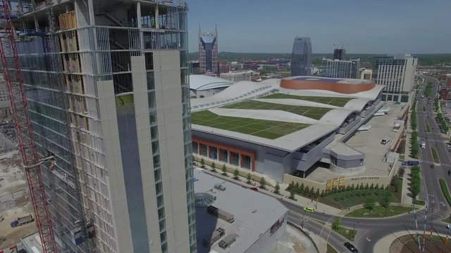	Rising Over Skycraper Under Construction Towards Nashville Skyline