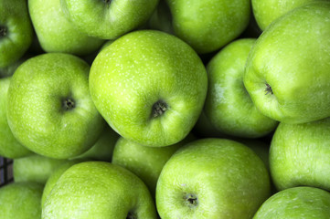 Green apples in a box