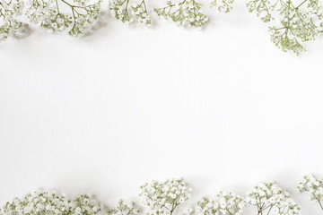 Styled stock photo. Feminine wedding desktop with baby's breath Gypsophila flowers on white...