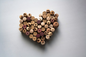 Wine corks heart shaped composition isolated on white