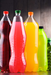 Plastic bottles of assorted carbonated soft drinks