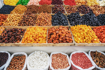 Dried fruits on food market, boxes with colorful assortment of vegetarian healthy dry fruits