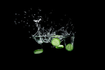 Fototapeta na wymiar cucumber in water with splash