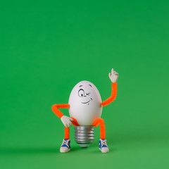 Winking Easter egg toy on a green