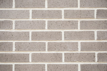 A new grey brick wall for a texture and patterned background.