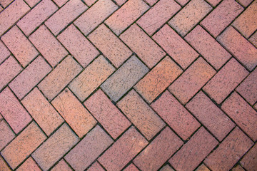 A brick angled sidewalk for a patterned background.