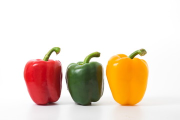 Fresh vegetables sweet red,yellow and green pepper isolated on white background.