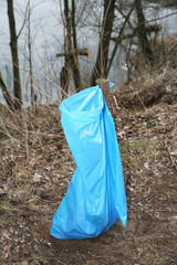 Method of suspending sacks on waste in scenic water.
