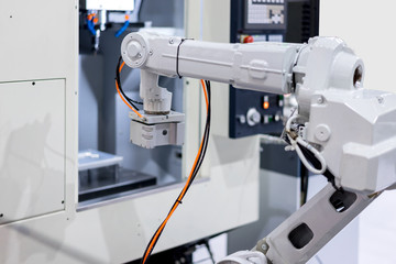 Mechanical hand robot loading automotive part working