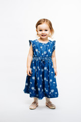 Full body portrait of a cute little preschool girl on white background