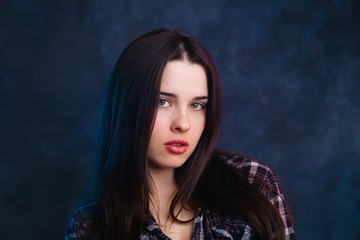 Fototapeta premium Shy beautiful woman looking at camera. Emotions and feelings concept