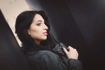Portrait of a beautiful and stylish brunette girl.