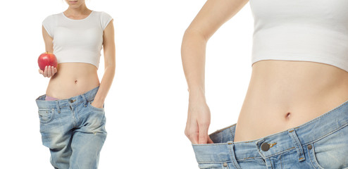 Young woman in jeans weight loss slimming with apple set