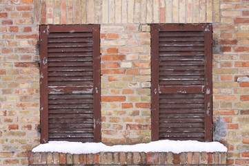 A Couple of wooden window with snow (Pesaro, Italy)