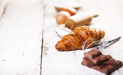 Croissants and ingredients for the preparation of bakery products.
