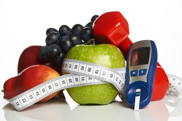 Diabetes monitor, cholesterol diet and healthy food eating nutritional concept with fresh fruits...