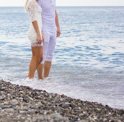 Young happy couple on the beach